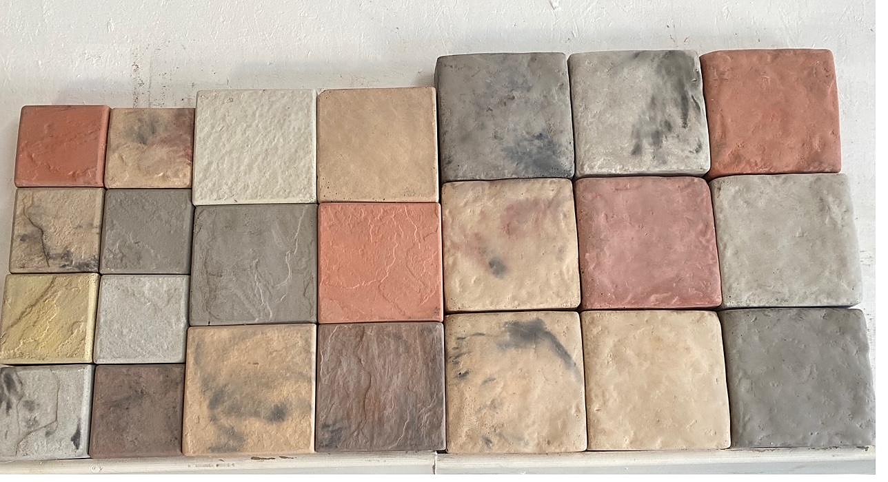 A wall display of SanStone cobbles in many colours