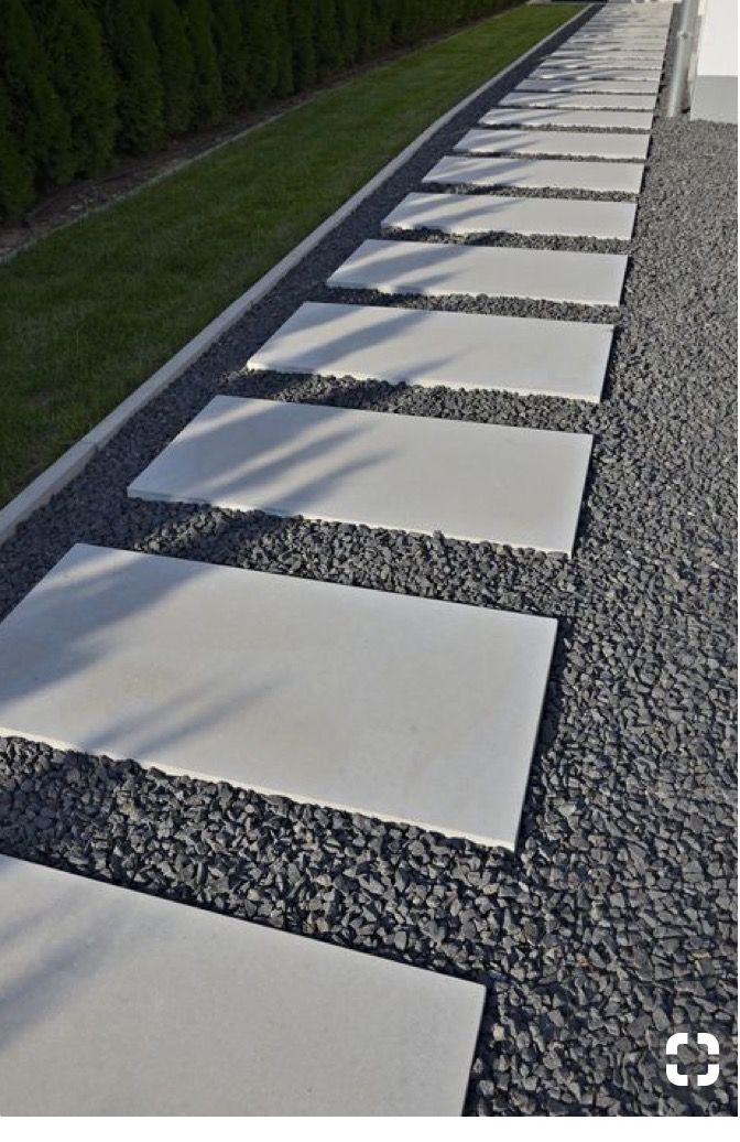 Large-format smooth pavers set in gravel