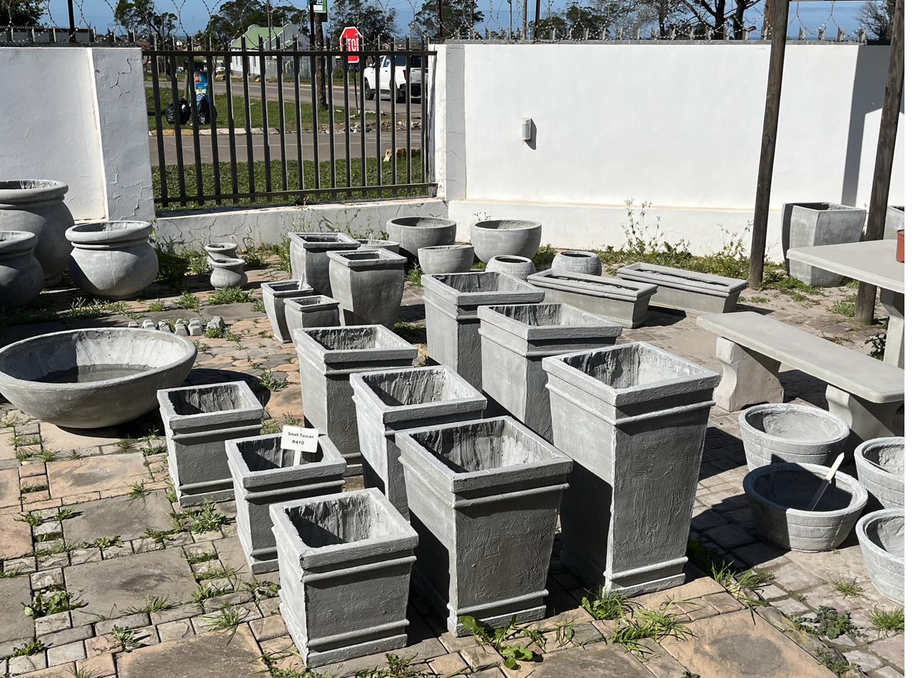 A display of cement pots in the SanStone showroom garden